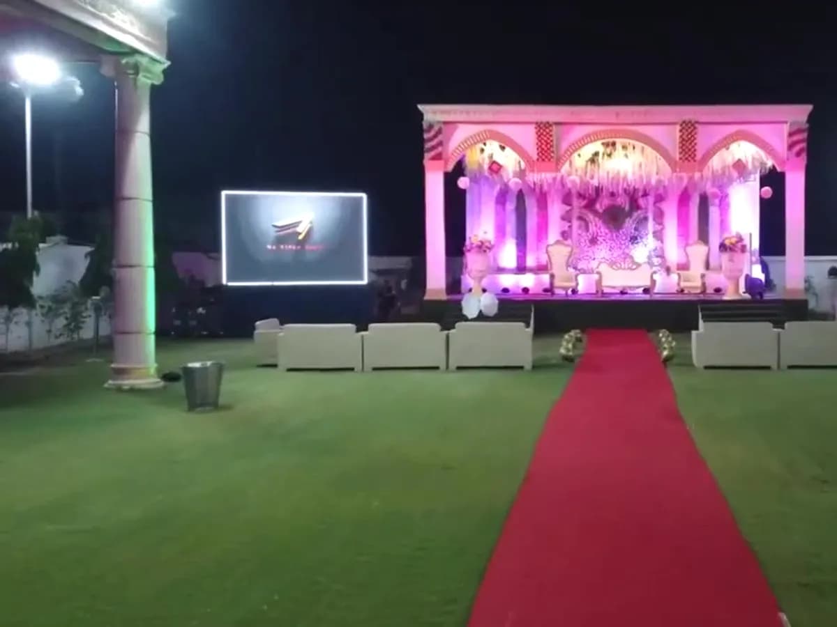 LED wall beside a decorated wedding stage